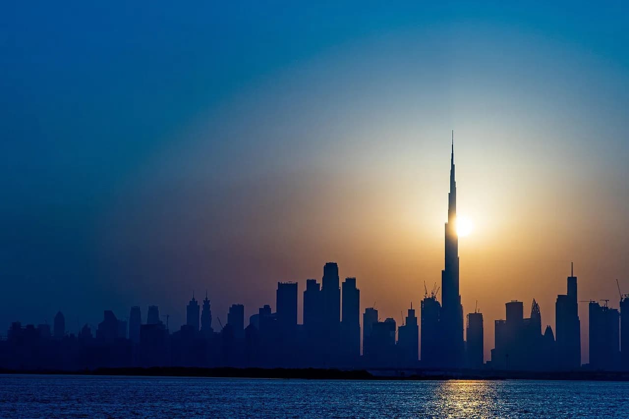 dubai, skyline, uae, emirates, cityscape, skyscrapers, buildings, silhouette, water, sea, downtown, tourism, sun, nature, backlighting, landmark, famous, city